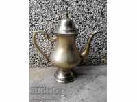 Old brass teapot with silver-plated coffee pot jug kitchen utensils