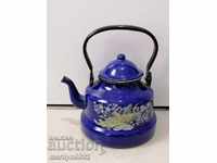 Enameled painted teapot from the saucepan dish with enamel jug pots