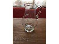 Old engraved glass jug
