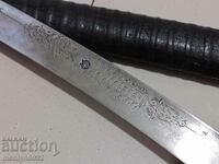 Ένα μαχαίρι με σφραγίδα και γκραβούρες με μαχαίρι kaniya karakulak khayduški