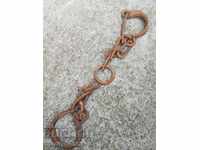 Pair of beads, pranks, chains, wrought iron