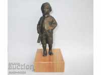 Old metal figure statuette Boy Hunter with a rifle