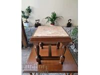 A lovely antique solid wood coffee table with a marble top