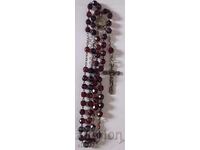 Old rosary with garnet stones